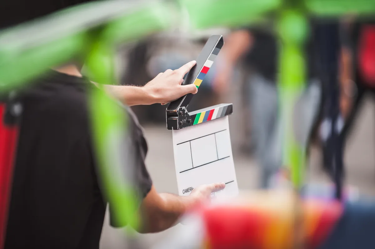 Actor performing a scene on a film set under production lights