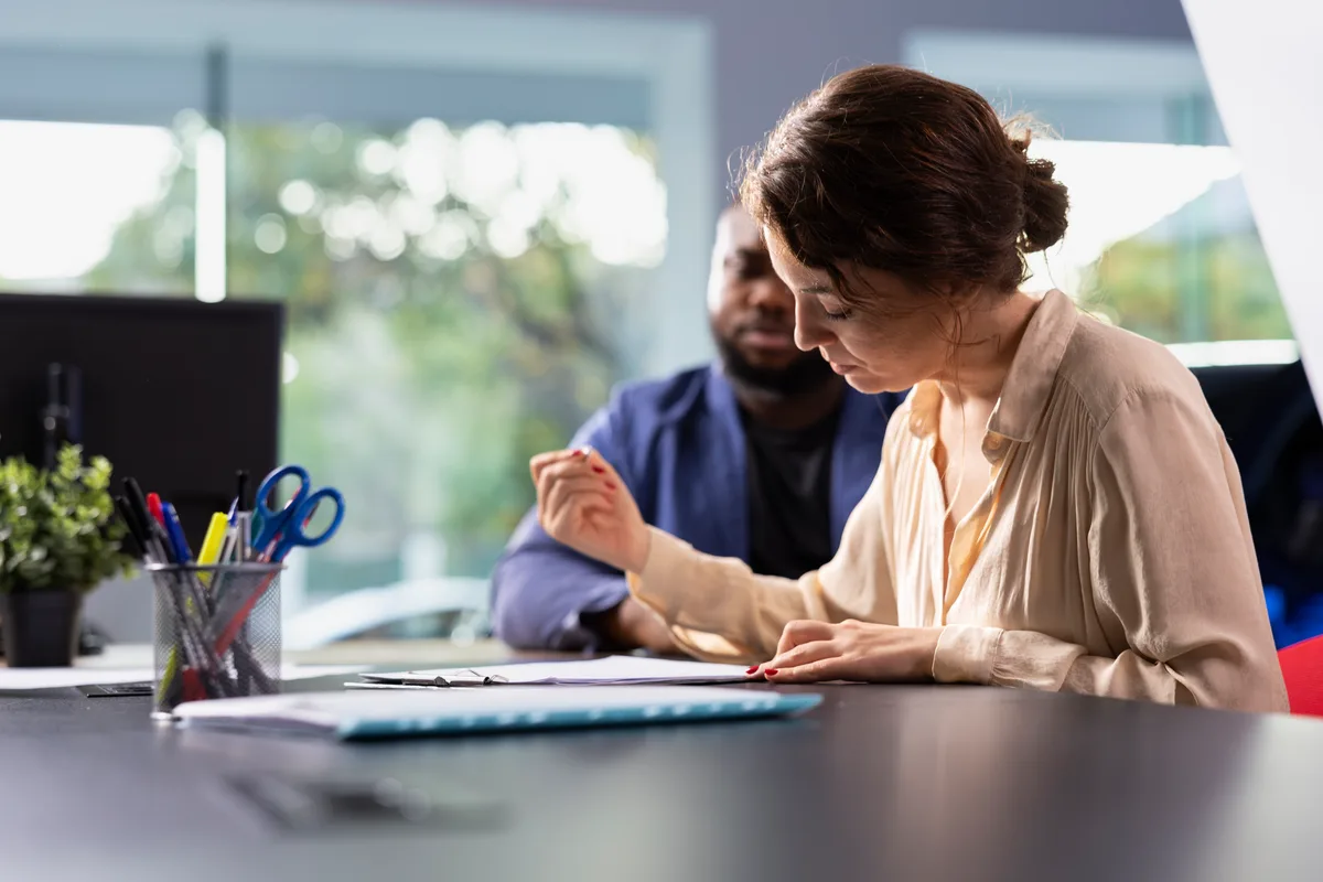 AnalytIQ advisor answering a client’s questions across the desk