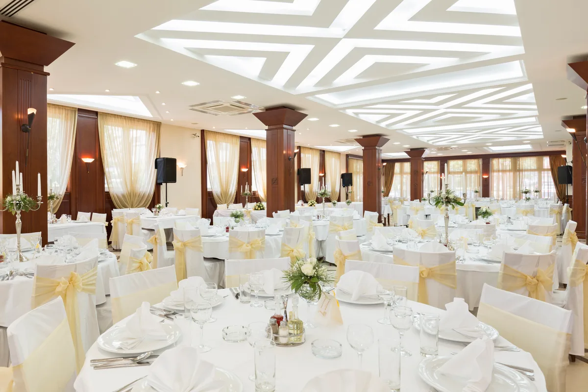 Banquet hall set with tables and chairs before an event