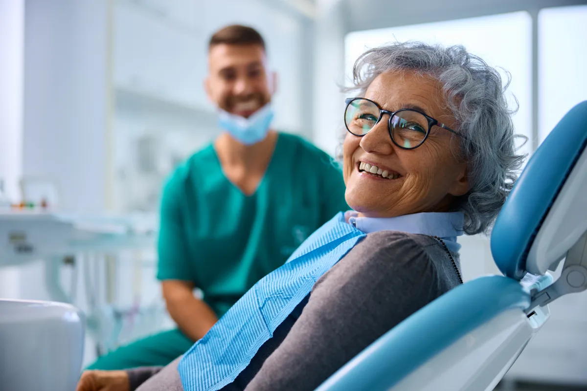 Dentist treating a patient in a modern dental operatory