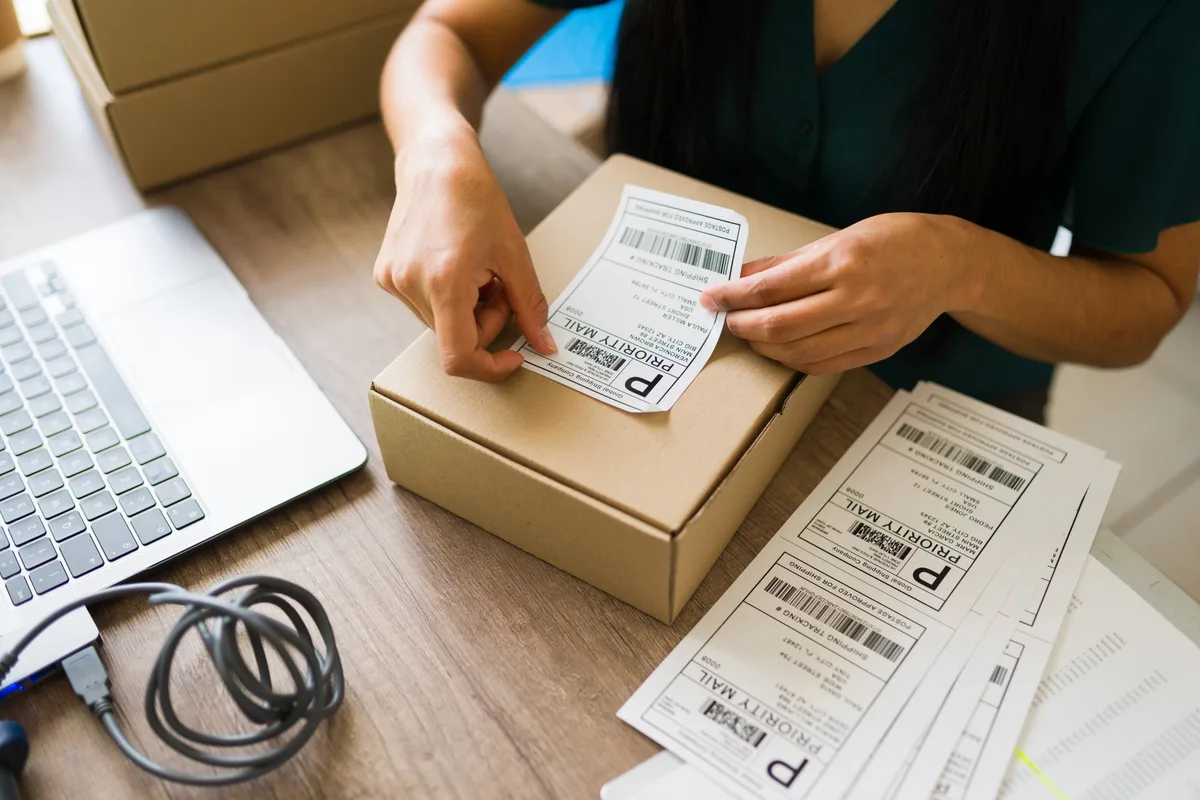 Dropshipping order screens and courier parcels ready for dispatch