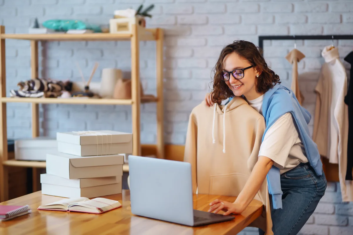 Online store owner packing customer orders