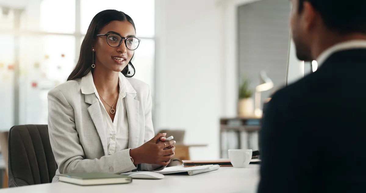 HR consulting firm owner reviewing revenue reports on a laptop