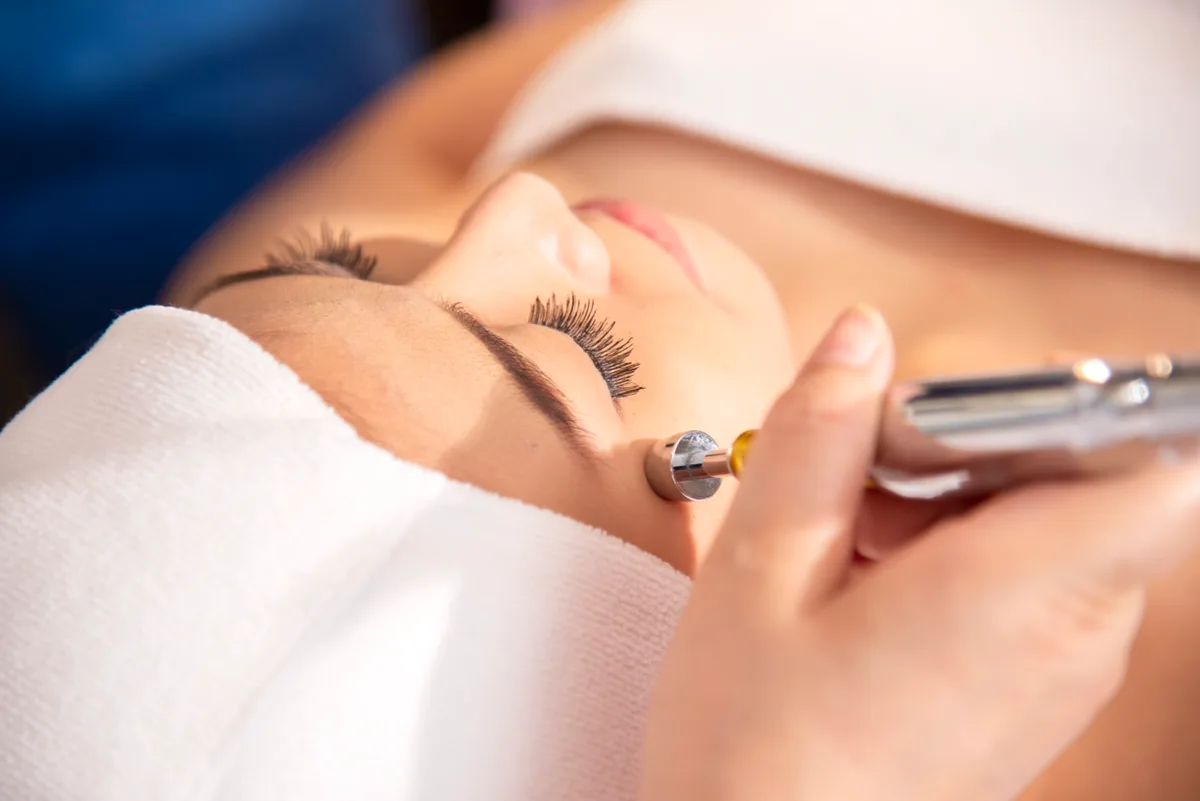 Client receiving a laser treatment at a medical spa