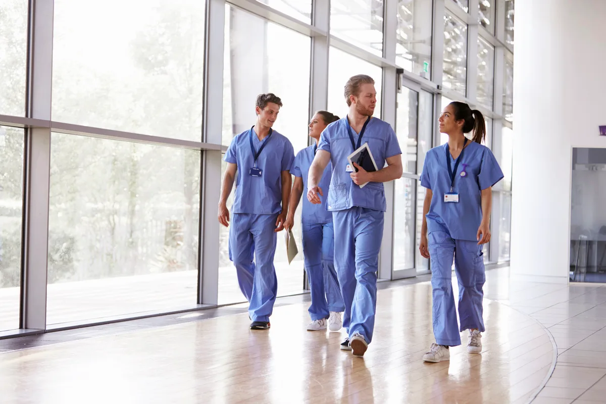 Nurse working at a station in a hospital ward