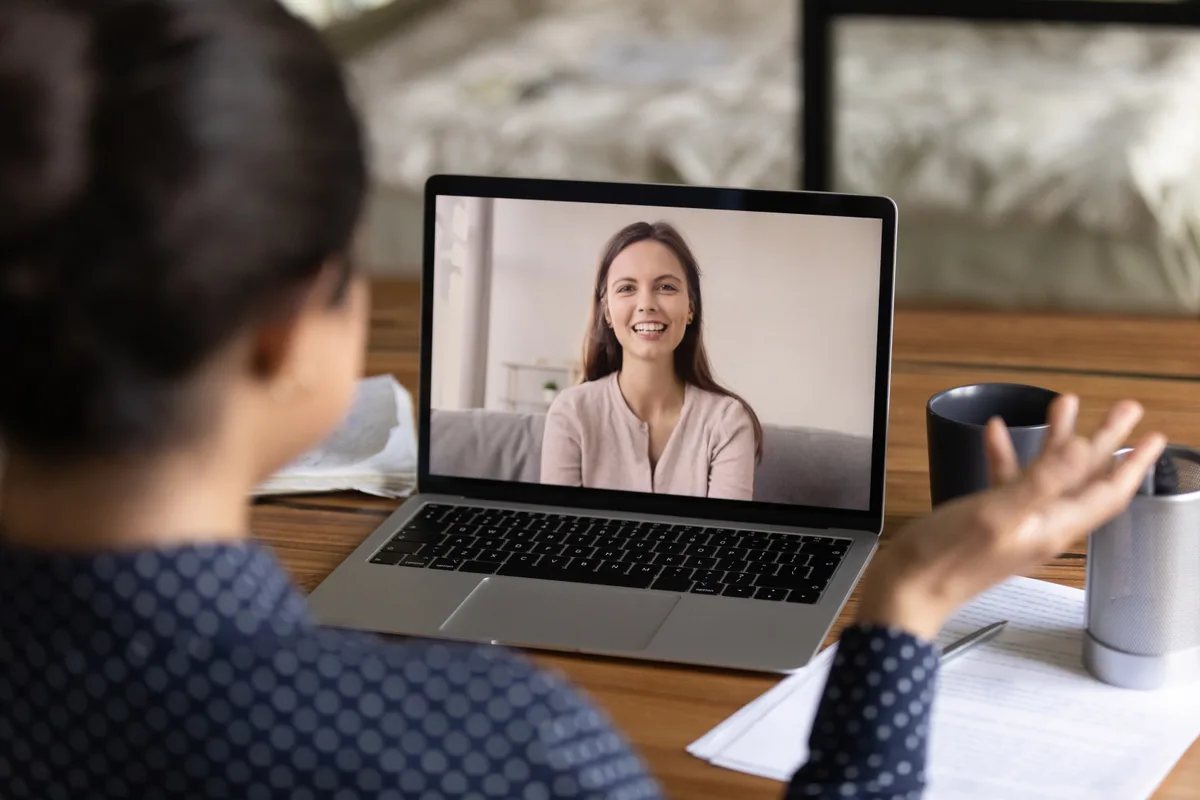 Online coach speaking with clients over a webcam call