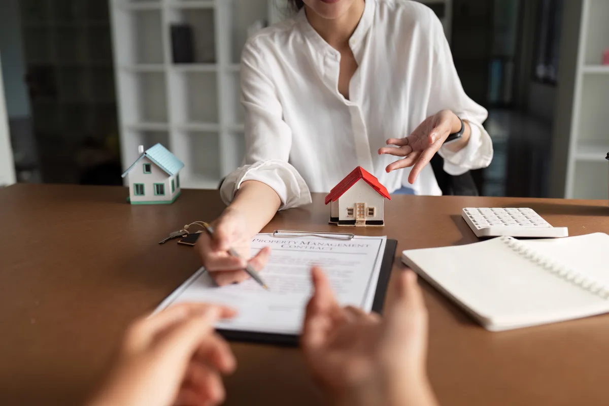 Real estate agent presenting a property to prospective buyers