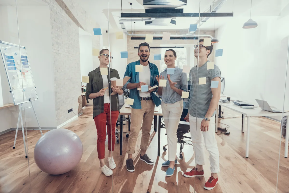 SaaS startup founders working together in their office