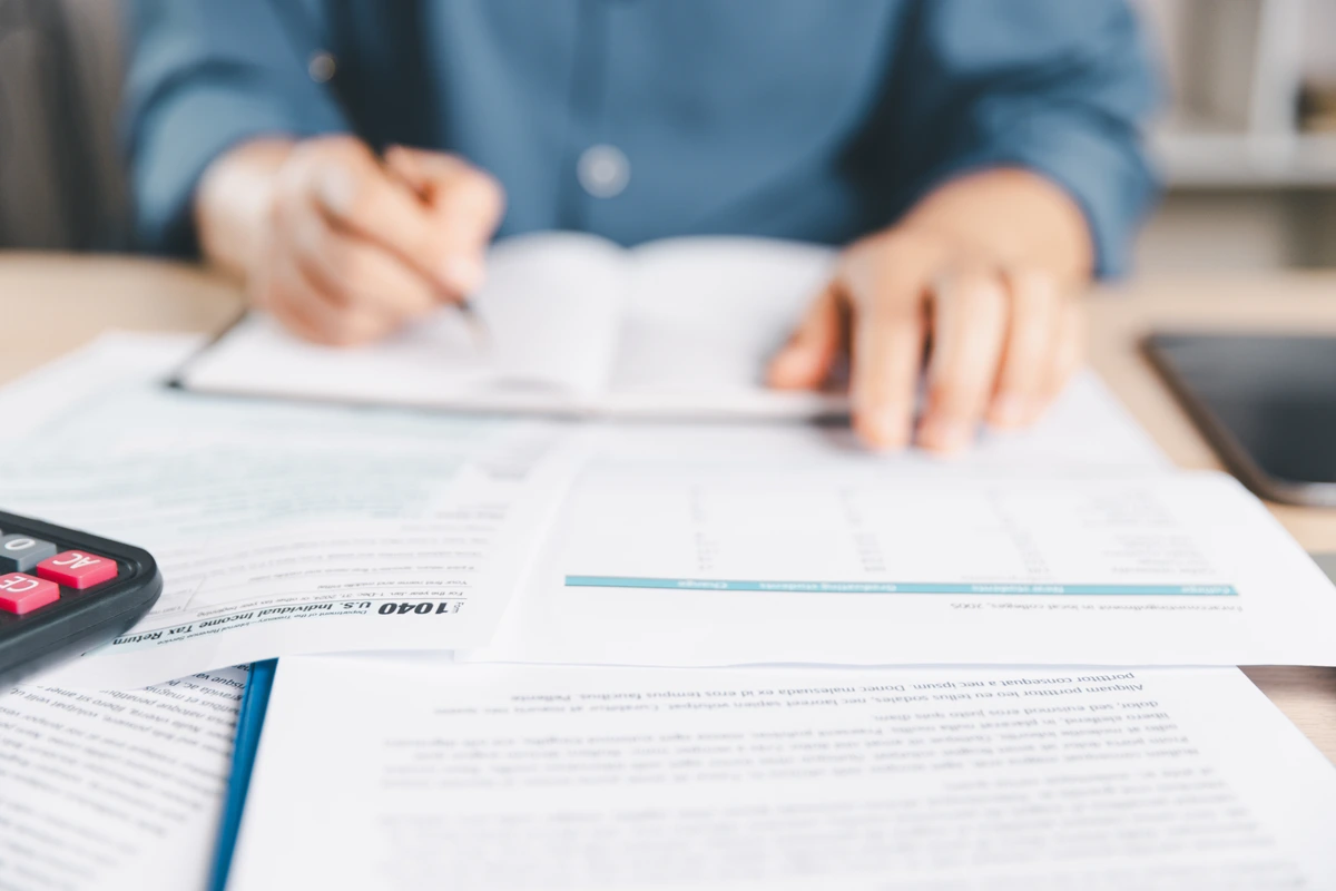 Tax preparer reviewing US and Canadian tax documents