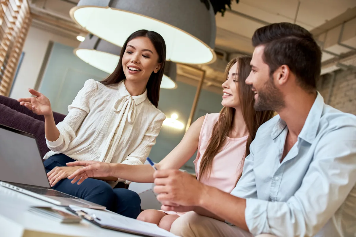 Travel agent working with a client in an agency office
